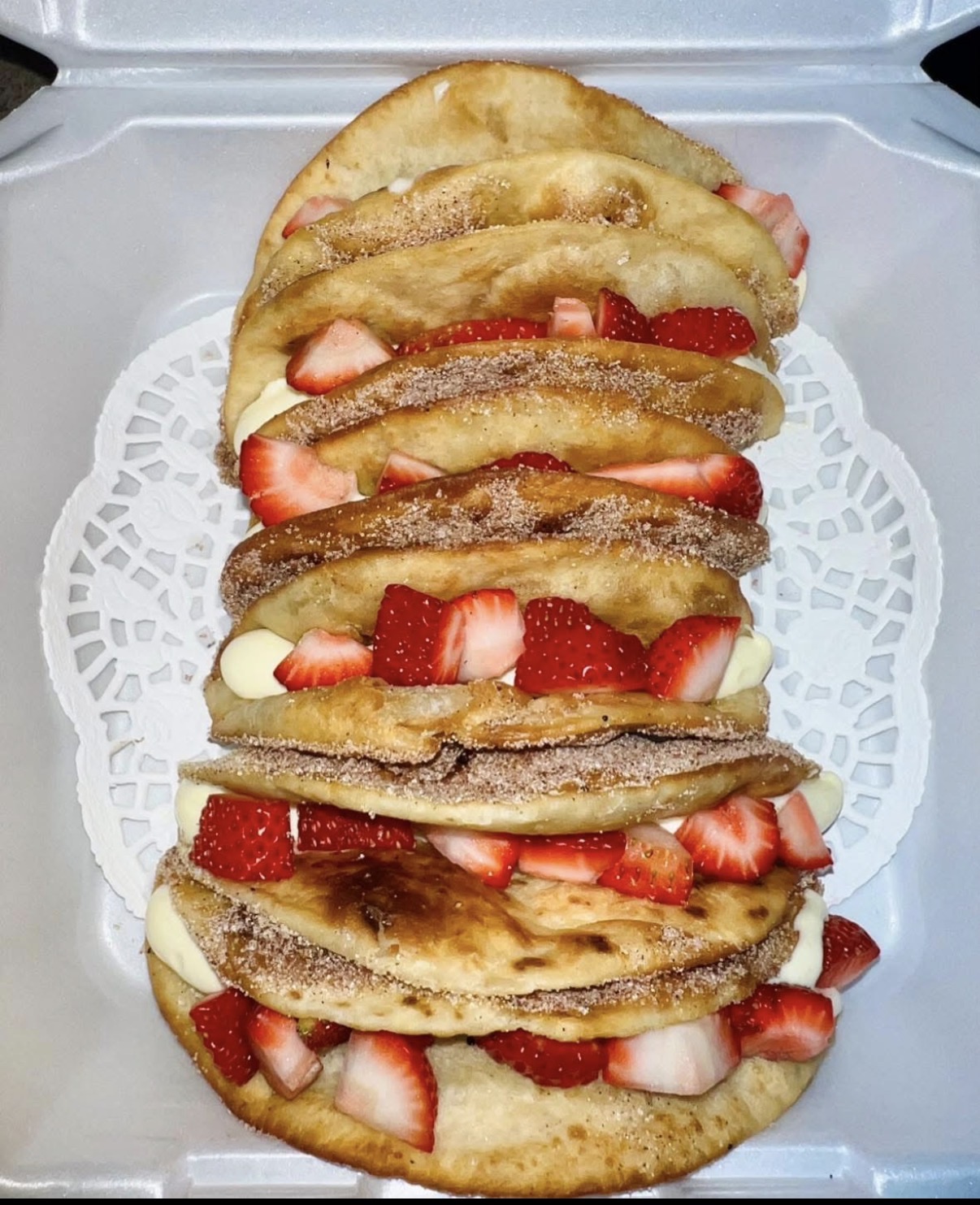 Strawberry Churro Tacos — Cinnamon sugar shells, sweet cream, fresh strawberries